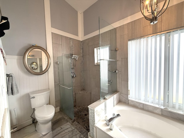 full bathroom with tiled shower, toilet, a garden tub, and wainscoting