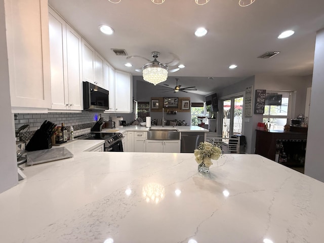 kitchen featuring appliances with stainless steel finishes, a peninsula, ceiling fan, white cabinets, and recessed lighting