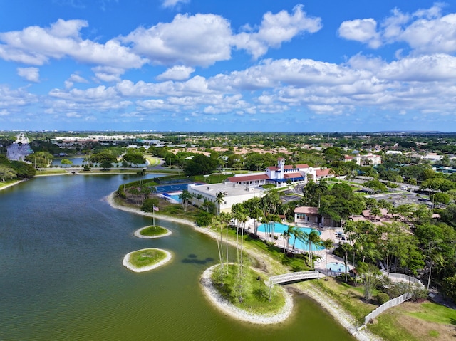 aerial view of a nearby body of water and a pool area