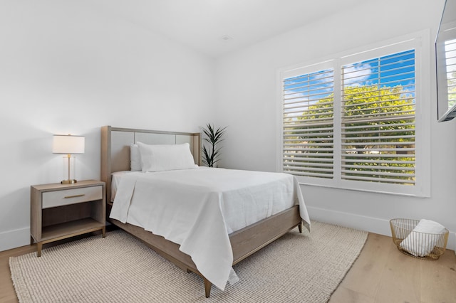 bedroom with wood finished floors