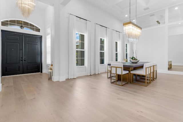 5351 N Sterling Ranch Cir, Davie, FL 33314 - entrance foyer with a chandelier, coffered ceiling, light wood-style flooring, beam ceiling, and baseboards