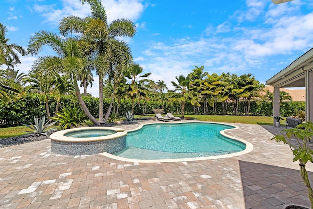 view of swimming pool with a patio and a pool with connected hot tub