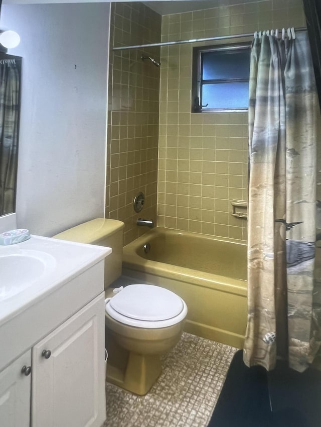 bathroom with shower / bathtub combination with curtain, vanity, toilet, and tile patterned floors