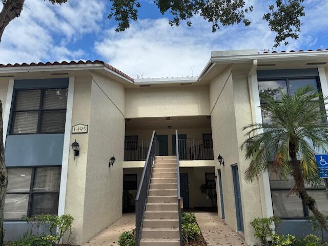 doorway to property with stucco siding