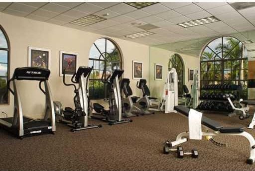 workout area with a paneled ceiling