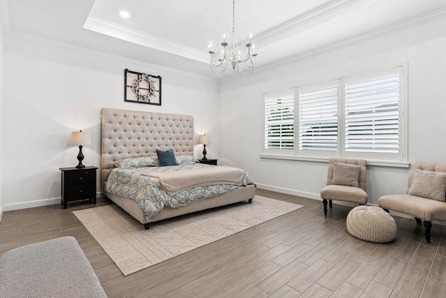 962 Castaway Ct, Loxahatchee, FL 33470 - bedroom featuring a chandelier, wood finished floors, ornamental molding, baseboards, and a raised ceiling