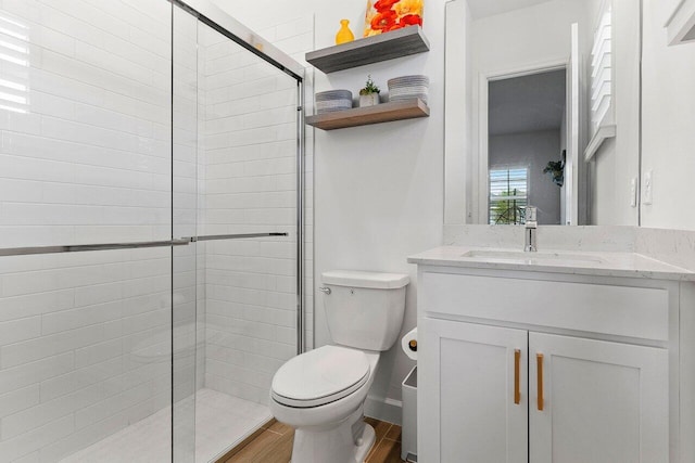 962 Castaway Ct, Loxahatchee, FL 33470 - bathroom featuring a stall shower, toilet, vanity, and wood finished floors