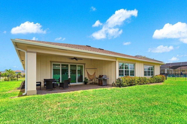 962 Castaway Ct, Loxahatchee, FL 33470 - back of property with a patio and ceiling fan