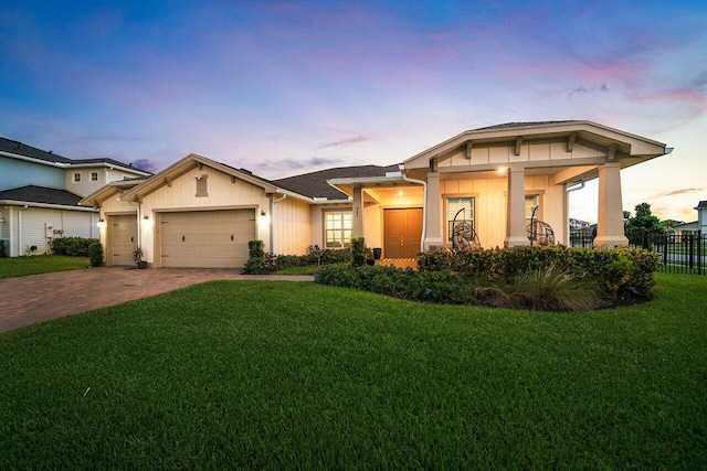 962 Castaway Ct, Loxahatchee, FL 33470 - view of front of house with a garage, driveway, and board and batten siding