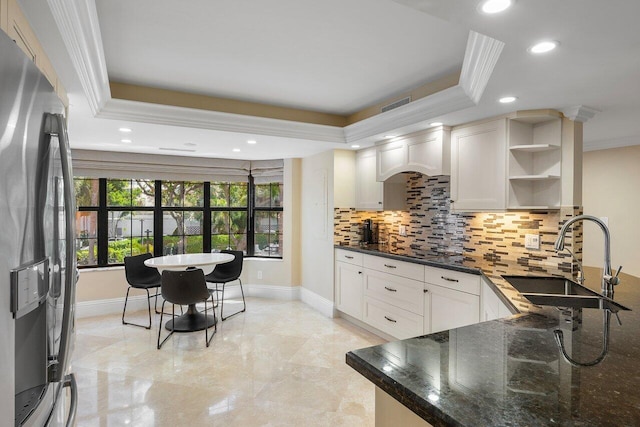 4401 N Ocean Blvd Unit 12, Boca Raton, FL 33431 - kitchen featuring stainless steel refrigerator with ice dispenser, a sink, tasteful backsplash, crown molding, and open shelves