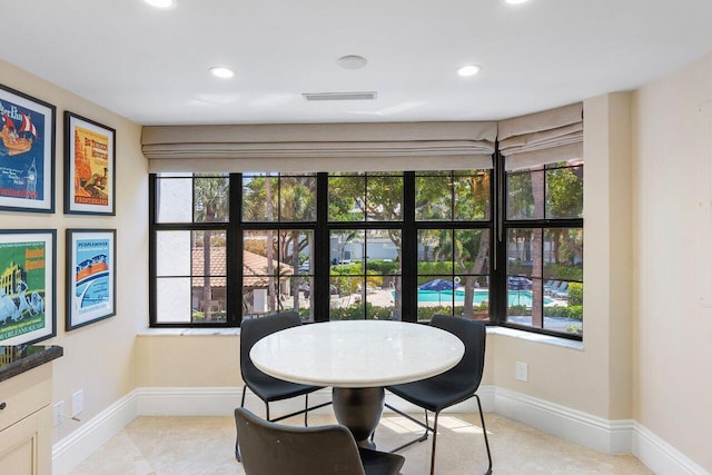 4401 N Ocean Blvd Unit 12, Boca Raton, FL 33431 - dining area with healthy amount of natural light, baseboards, recessed lighting, and light tile patterned flooring