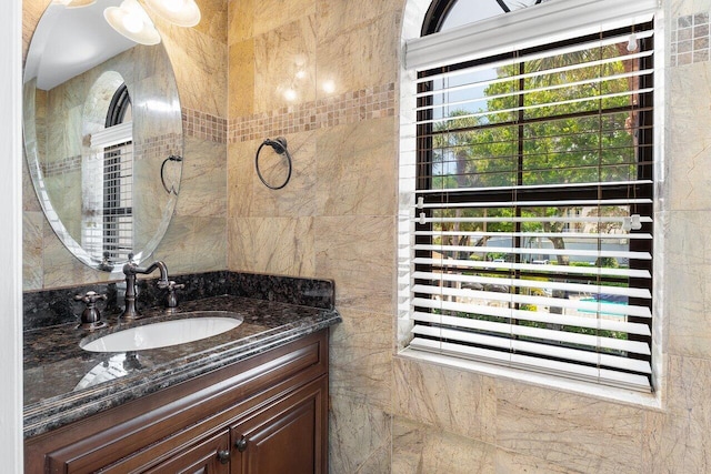 4401 N Ocean Blvd Unit 12, Boca Raton, FL 33431 - bathroom featuring vanity and tile walls
