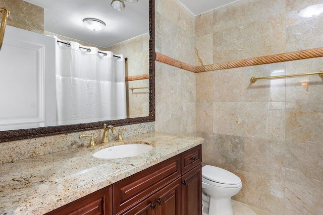 4401 N Ocean Blvd Unit 12, Boca Raton, FL 33431 - full bath with tile walls, toilet, vanity, and curtained shower