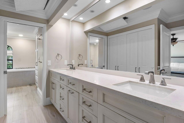 4401 N Ocean Blvd Unit 12, Boca Raton, FL 33431 - bathroom with crown molding, double vanity, and recessed lighting