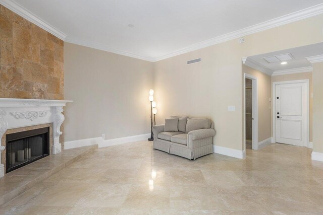 4401 N Ocean Blvd Unit 12, Boca Raton, FL 33431 - sitting room with ornamental molding, baseboards, and a fireplace with raised hearth