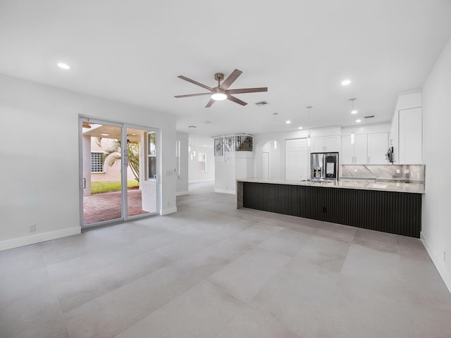 7285 Via Luria, Lake Worth, FL 33467 - unfurnished living room with baseboards, recessed lighting, visible vents, and ceiling fan