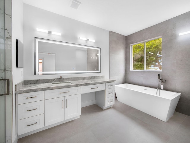 7285 Via Luria, Lake Worth, FL 33467 - full bath with a freestanding bath, a shower with door, and vanity