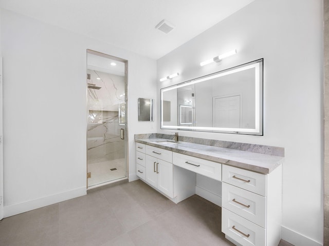 7285 Via Luria, Lake Worth, FL 33467 - bathroom with vanity, a marble finish shower, baseboards, and tile patterned floors