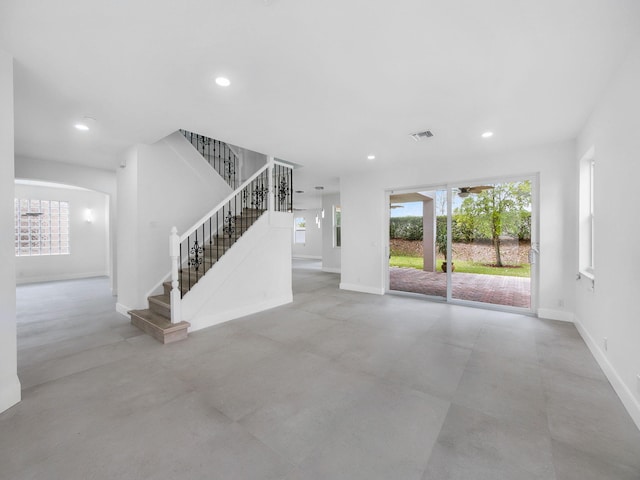 7285 Via Luria, Lake Worth, FL 33467 - unfurnished living room featuring stairway, baseboards, and plenty of natural light