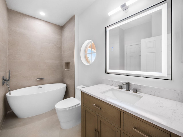 7285 Via Luria, Lake Worth, FL 33467 - bathroom with toilet, vanity, and a freestanding bath