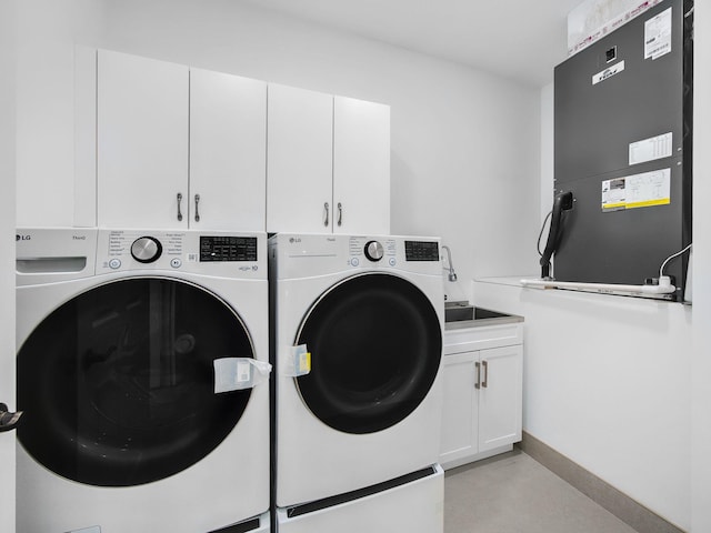 7285 Via Luria, Lake Worth, FL 33467 - laundry area featuring baseboards, heating unit, a sink, and washer and clothes dryer