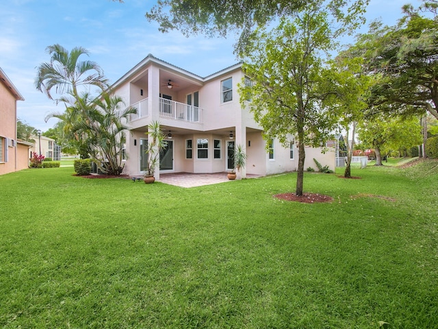 7285 Via Luria, Lake Worth, FL 33467 - back of property featuring a patio area, a balcony, a yard, stucco siding, and a ceiling fan