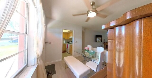 home office featuring a ceiling fan and healthy amount of natural light