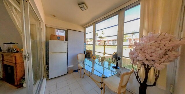 sunroom featuring tile patterned flooring