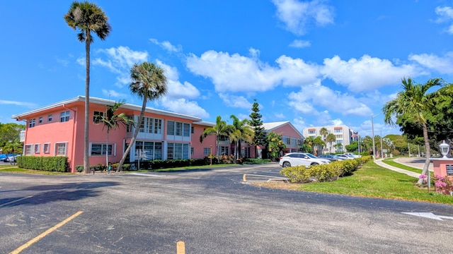 view of property featuring uncovered parking