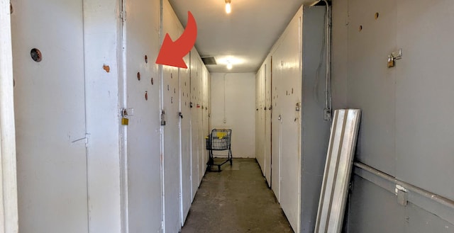 hallway with concrete flooring