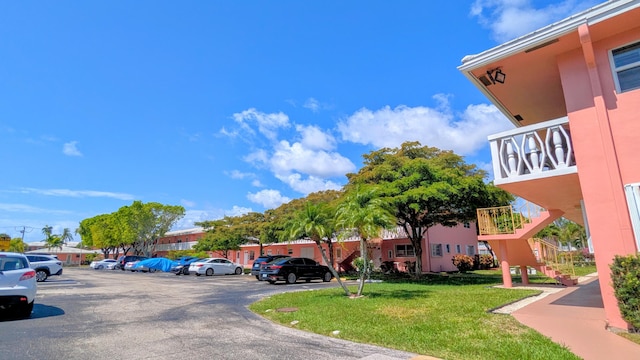 exterior space with uncovered parking and stairway