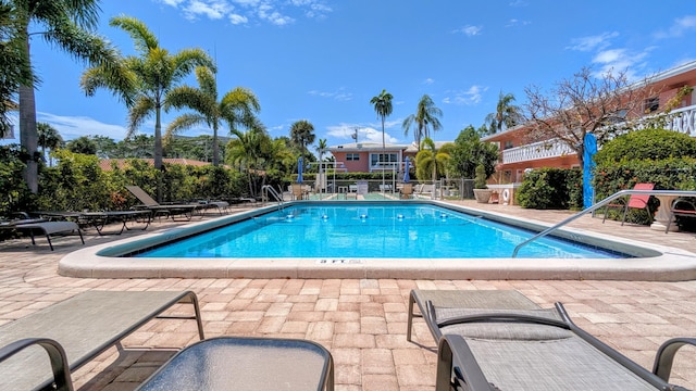 community pool featuring a patio area