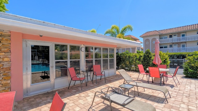 view of patio featuring fence
