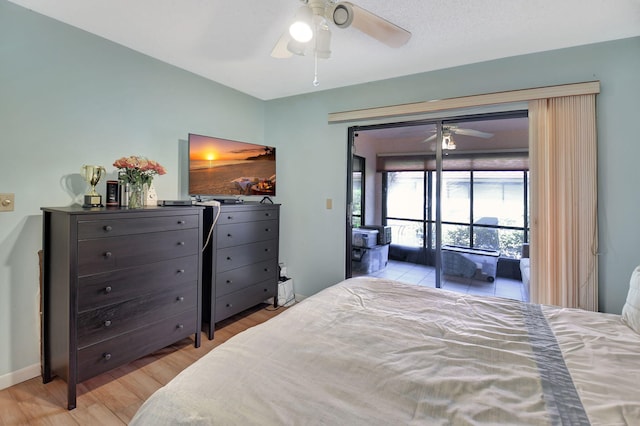 6235 Kings Gate Cir Unit C, Delray Beach, FL 33484 - bedroom with access to exterior, light wood-style flooring, and ceiling fan