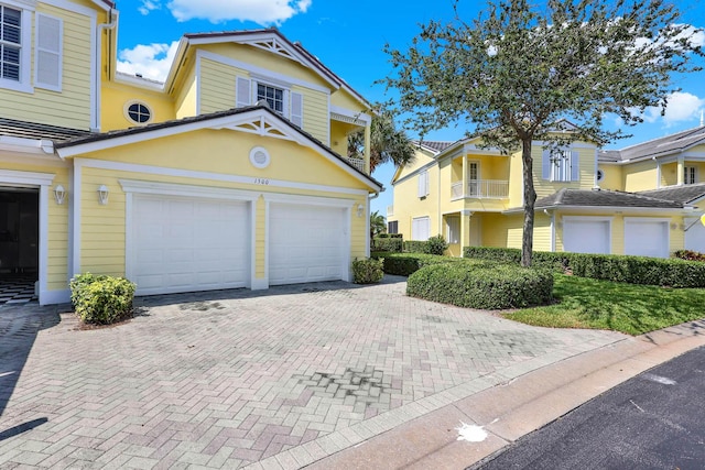 1500 Mariner Bay Blvd Unit 1500, Fort Pierce, FL 34949 - view of front of house featuring decorative driveway and an attached garage