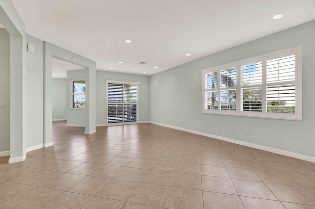 1500 Mariner Bay Blvd Unit 1500, Fort Pierce, FL 34949 - unfurnished living room with light tile patterned flooring, baseboards, and recessed lighting