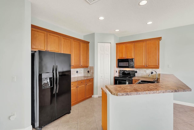 1500 Mariner Bay Blvd Unit 1500, Fort Pierce, FL 34949 - kitchen with black appliances, a sink, light tile patterned floors, tasteful backsplash, and recessed lighting