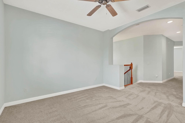 1500 Mariner Bay Blvd Unit 1500, Fort Pierce, FL 34949 - carpeted empty room featuring ceiling fan, arched walkways, baseboards, and recessed lighting