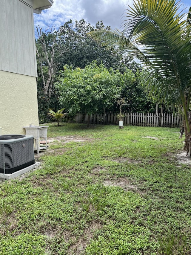view of yard with central AC