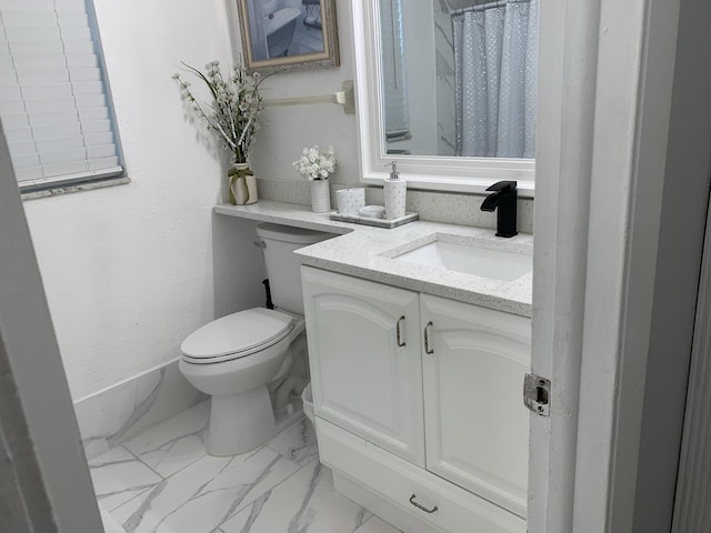 bathroom with toilet, marble finish floors, vanity, curtained shower, and baseboards