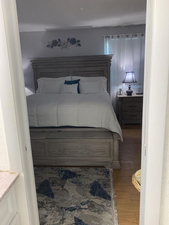 bedroom featuring light wood finished floors