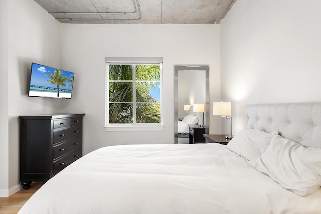bedroom with wood finished floors