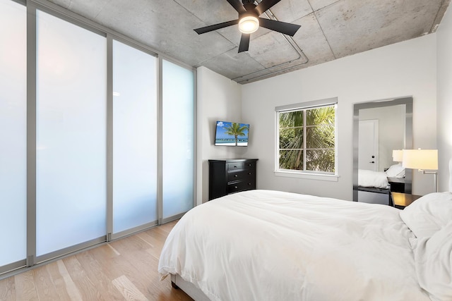 bedroom featuring wood finished floors and ceiling fan