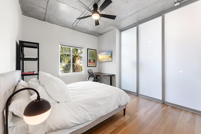 bedroom with a ceiling fan and light wood finished floors