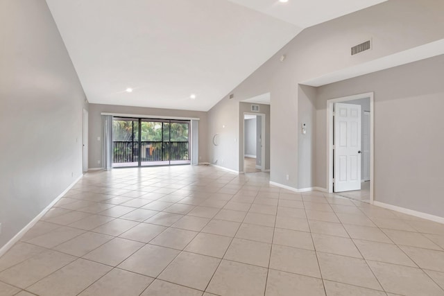 unfurnished room with light tile patterned flooring, baseboards, high vaulted ceiling, and recessed lighting