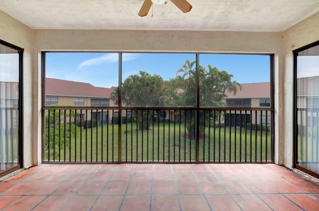 unfurnished sunroom with tile patterned flooring and healthy amount of natural light