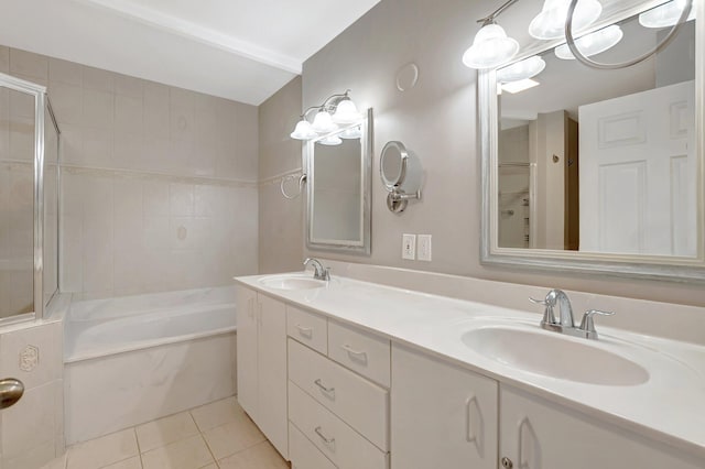full bath with tile patterned floors, a tub, double vanity, and a shower