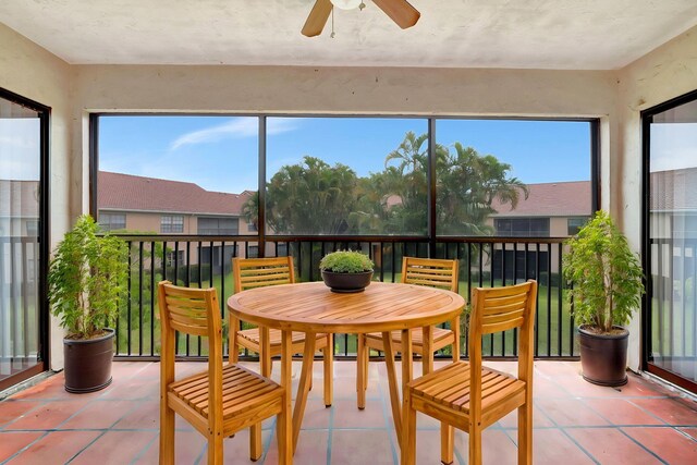 sunroom / solarium with tile patterned flooring and healthy amount of natural light