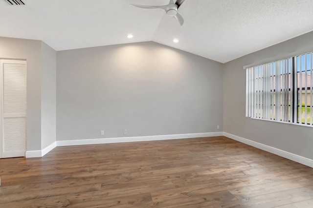 unfurnished room featuring a ceiling fan, baseboards, vaulted ceiling, recessed lighting, and wood finished floors