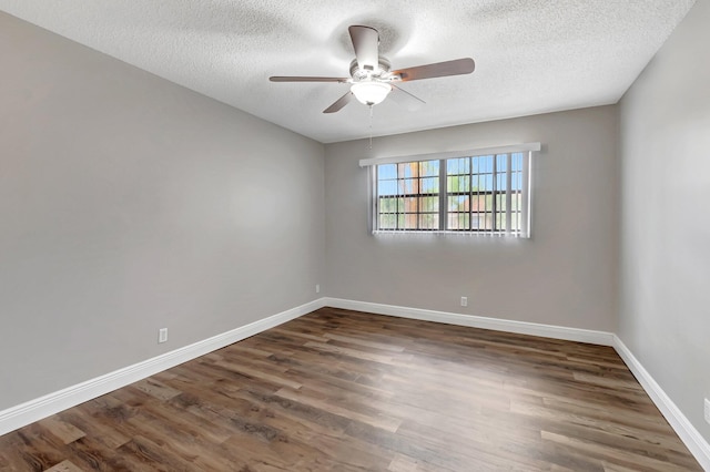 unfurnished room with wood finished floors, ceiling fan, a textured ceiling, and baseboards
